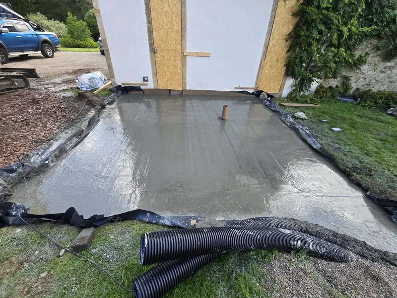 Freshly poured concrete foundation slab